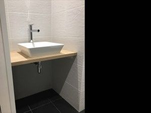 Reforma integral de un piso en Barcelona realizada por Contemporánea - baño invitados